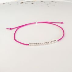 Minimalist, wearable and delicate silver multicolor thread bracelet available in several colors. Length: 20cm adjustable knot. Width: 2mm. Fully adjustable, Handmade in Spain. More colors available in this product => https://www.etsy.com/listing/845364478/tiny-simple-cord-sterling-silver-wish Ideal for a gift and for combinate with other bracelets. All our products are presented in a white organza bag. ♡ Made with love in Valencia ♡ ----------------------------- Discover the NICTE bracelets c Minimalist Silver Friendship Bracelets, Minimalist Sterling Silver Friendship Bracelets, Minimalist Silver Resizable Friendship Bracelet, Minimalist Silver Beaded Bracelets With Adjustable Length, Handmade Minimalist Friendship Bracelets, Silver Friendship Bracelet With Sliding Knot, Minimalist Adjustable Silver Friendship Bracelets, Silver Adjustable Minimalist Friendship Bracelets, Silver Friendship Bracelets With Adjustable Round Beads