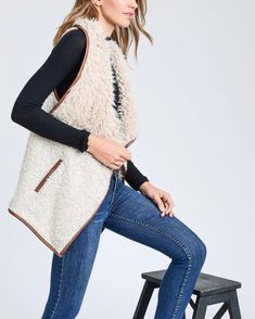 Sherpa vests are always the cutest during fall and winter, especially over a pair of long sleeves, denim jeans, and boots! Take our advice and grab a hold of this vest that features a super soft and cozy wool blend, open front, fold over collar, two functional side pockets, and a faux leather trim. color: beige tone ivory + tan acrylic/wool/polyester blend imported professionally clean Trendy Cotton Sweater Vest For Fall, Trendy Winter Sweater Vest For Everyday, Trendy Everyday Winter Sweater Vest, Trendy Fall Sweater Vest For Everyday, Trendy Sweater Vest For Everyday Fall Wear, Trendy Cotton Vest For Fall, Fall Vest With Pockets, Trendy Sleeveless Denim Vest For Winter, Fall Sweater Vest With Pockets For Layering