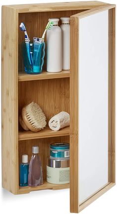 a wooden cabinet with three shelves and various items on it's sides, including toothbrushes, shampoos, and other personal care products