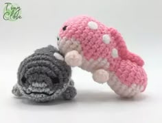 two small crocheted toys are next to each other