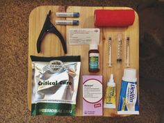 an assortment of medical supplies laid out on a wooden tray