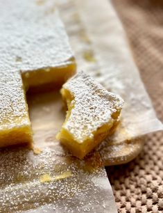 two pieces of cake sitting on top of paper