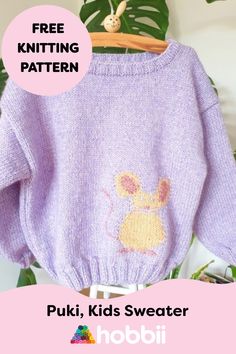 a purple sweater with a mouse embroidered on it