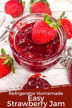 homemade strawberry jam in a glass jar with fresh strawberries