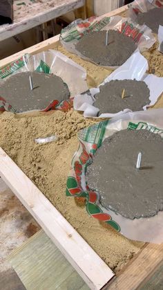 cement is being made in the shape of flower pots