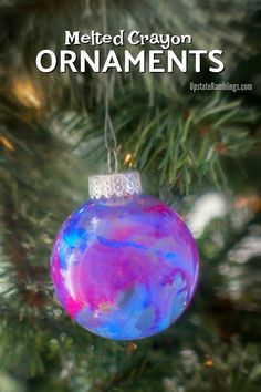 an ornament hanging from a christmas tree with the words melted crayon ornaments