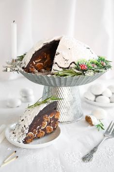 a piece of cake on a plate with a candle in the middle and other decorations around it