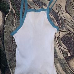 Super Cute Never Worn. Light Blue Color Blue Outline. Small Fits Like A Small But Can Stretch Fitted Light Blue Cropped Top, Light Blue Ribbed Tank Top, Blue Ribbed Cropped Tank Top, Light Blue Seamless Sleeveless Crop Top, Cheap Blue Stretch Cropped T-shirt, Top Light, Light Blue Color, Crop Tank, Cropped Tank Top