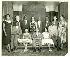 a group of people are posing for a photo