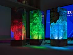 three different colored lights in front of a computer screen with the numbers 350 on it