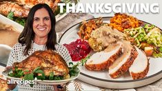 a woman standing in front of a table full of thanksgiving food