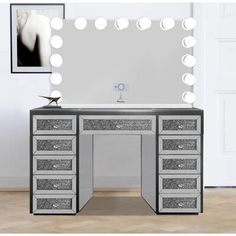 an image of a vanity with lights and drawers in the room that looks like it is going to be used for makeup