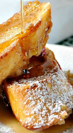 french toast with syrup being drizzled on top