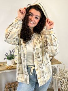 Experience ultimate comfort and style with our Cinnamon Stroll Plaid Long Sleeve Hood Shacket Shirt Top. The creams and beiges in this plaid design add a touch of sophistication, while the shirt style and 2 front pockets provide functionality. Stay cozy and chic with this versatile hoodie top. Fabric: 100% Polyester Beige Long Sleeve Flannel Shirt For Fall, Casual Cream Button-up Shacket, Casual Cream Collared Shacket, Beige Long Sleeve Casual Flannel Shirt, Casual Beige Long Sleeve Flannel Shirt, Beige Casual Button-up Flannel Shirt, Casual Beige Button-up Flannel Shirt, Casual Cream Shacket With Pockets, Casual Beige Collared Shacket