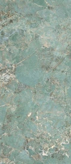 a green marble counter top that looks like it has been painted with blue and white paint