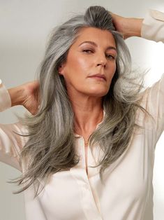 A light gray base with medium gray strands, this warm-toned greige salt and pepper shade lets you get back to your roots. Excerpt Length: 16" inches faq how-do-i-choose-the-right-color-gray-extensions what-lengths-do-you-offer how-do-i-choose-the-right-luxy-hair-set what-is-the-difference-between-classic-and-seamless-extensions can-i-dye-curl-and-straighten-my-hair-extensions how-do-i-care-for-my-extensions how-long-does-shipping-take-1 Add Volume To Your Hair, Luxy Hair Extensions, Styling Mousse, Seamless Hair Extensions, Luxy Hair, Hair Quiz, Halo Hair Extensions, Transition To Gray Hair, Clip In Ponytail