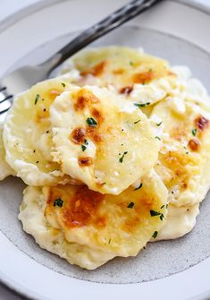 some food is sitting on a plate with a fork