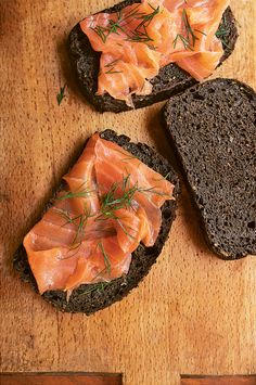 two slices of bread with salmon on them