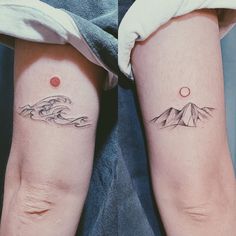 two people with matching tattoos on their legs, one has a mountain and the other is a wave