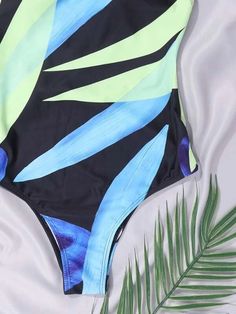 Description:Style:BohoColor:MulticolorPattern Type:PlantsNeckline:One ShoulderDetails:KnotBra Type:Wireless BraBody:YesChest pad:Yes,can be removedMaterial:PolyesterComposition:82% Polyester, 18% SpandexFabric:High Stretch Multicolor Print Swimwear For Beach, Green Swimwear With Vibrant Print For Vacation, Green Vibrant Print Swimwear For Vacation, Green Vibrant Print Swimwear For Beach Party, Green Leaf Print Swimwear For Vacation, Green Tropical Swimwear For Festival, Bohemian Green Swimwear For Pool, Bohemian Blue Swimwear With Tropical Print, Leaf Print Beachwear For The Beach