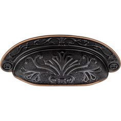 an ornate black metal door handle on a white background