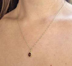 Gold Garnet necklace, 14k gold pendant necklace, January birthstone necklace mom, Red Garnet necklace, January Birthday, Gold Garnet Jewelry This minimalist Garnet necklace was set with a deep red January birthstone pendant, to beautifully accompany you through your busy days. The classic design is always pretty for day and evening, work or fun. The Red oval necklace is handmade and delicate and is just a great January birthstone necklace and the perfect chic and elegant gift. Dimensions: Oval p Red 14k Gold Birthstone Necklace, Dainty Red 14k Gold Necklace, Minimalist Red Gemstone Birthstone Necklace, 14k Gold Bezel Setting Birthstone Necklace Gift, 14k Gold Birthstone Necklace With Bezel Setting As Gift, Ruby Birthstone Necklace As Gift, Red Sterling Silver Jewelry For Mom, Red Sterling Silver Jewelry As Gift For Mom, Dainty Birthstone Pendant Necklace For Anniversary