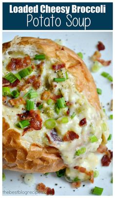 loaded cheesy broccoli potato soup in a bread bowl on a white plate