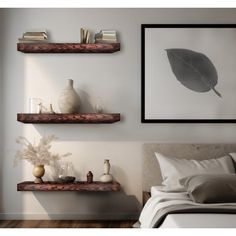 two floating shelves on the wall above a bed