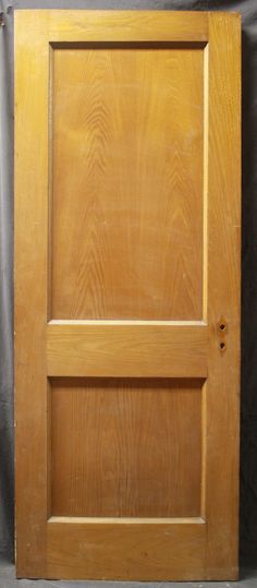 an unfinished wooden door on a black background