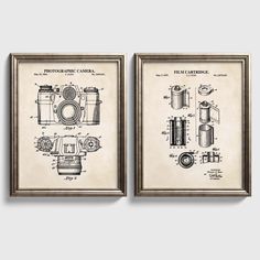 two framed photographs with cameras on them, one is blueprinted and the other has an old fashioned camera