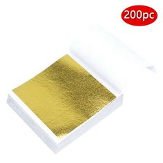 gold foil on white paper with red sticker in the background and 200p per pack