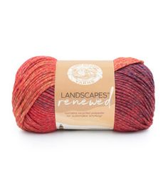 red and orange yarn with the words landscapes removed in white lettering on an orange background