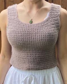 The crochet construction of the tank top adds a charming handmade touch, creating a delicate and intricate texture that adds visual interest and depth to the design. Whether you're lounging at home, heading to the beach, or meeting friends for brunch, our crochet tank top adds a touch of bohemian flair to your look. Embrace laid-back elegance with our Crochet Purple/Tan Tank Top and elevate your look with a touch of bohemian charm. Whether you're running errands around town or relaxing at home, our tank top is the perfect choice for effortless style and comfort all season long. Crochet Construction, Crochet Purple, Tan Crochet, Tan Tank Top, Crochet Tank Top, Meeting Friends, Crochet Tank, Crochet Art, Dallas Tx