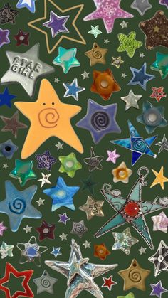 many different colored stars on a green background