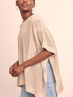 Refined neutrals. The sartorial bridge between two seasons, our open knit cotton poncho was made for the beach and beyond. Wear as a cover up, top layer to your lightweight denim, or foundation piece for your midi skirt. | J.McLaughlin Women's Katja Poncho Sand/Off White | Cotton Spring Knit Cover-up For Warm Weather, Chic Spring Layering Cover-up, Spring Beach Sweater In Chunky Knit, Spring Chunky Knit Beach Sweater, Spring Chunky Knit Sweater For Beach, Beige Open Knit Cover-up For Spring, Chunky Knit Sweater For Spring Beach Outings, Spring Knit Cover-up, Beige Summer Sweater For Layering