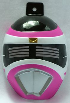 a pink and white helmet is on display