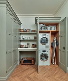 a washer and dryer sitting in a closet next to each other on shelves