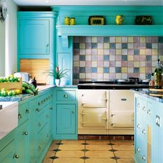 a kitchen with blue cabinets and tile flooring on the walls is pictured in this image