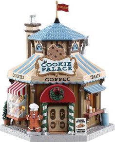 a small toy store with cookies and other items on the front porch, including an ice cream parlor