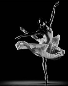 a black and white photo of a ballerina