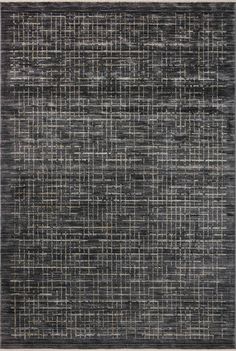 an area rug with squares and lines in grey, black and beige colors on the floor