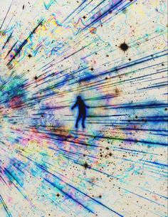 a man is walking through the center of an art work with multiple colors and lines