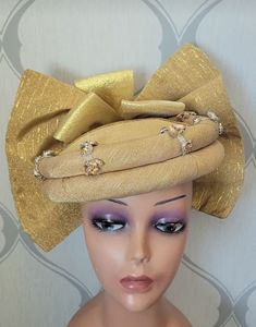 Beautiful Auto gele/headpiece for that upcoming occasion or event, suitable for wedding parties, bridesmaids outfits, engagement ceremony, owanbe, Igbo hausa wedding, Nigerian African wedding party, 40th birthday outfit, 50th birthday African dress etc. Message for preorder. Elegant Fitted Costume Hats And Headpieces For Holidays, Gold Fitted Sets For Evening, Glamorous Gold Organza Sets, Glamorous Gold Sets For Festivals, Elegant Evening Sets For Festivals, Gold Fitted Evening Sets, Vintage Costume Hats And Headpieces For Wedding Carnival, Elegant Fitted Headpieces For Holiday, Vintage Wedding Costume Hat With Pinched Crown