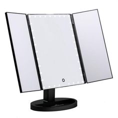 a black stand with a mirror and lights on it's sides in front of a white background