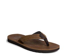 Reef Mens Voyage Le Flip Flop Sandal - Dark Brown Embrace the spirit of the beach with these leather Sandal s. Crafted from premium ISA lite full grain leather, these Sandalsare both stylish and functional. The non-abrasive strap, water-friendly design, and Swellular Technology make them perfect for any adventure, from the beach to the city.  Reef swellular signature technology  No break in period  Sustainably sourced ISA lite waterproof full grain leather  EVA footbed for Leather Open Toe Flip Flops For Surfing, Leather Beach Flip Flops With Cushioned Footbed, Brown Flip Flops With Leather Footbed For The Beach, Brown Leather Footbed Flip Flops For Beach, Rugged Open Toe Beach Sandals, Outdoor Leather Flip Flops With Textured Footbed, Brown Leather Flip Flops For Outdoor, Outdoor Leather Brown Flip Flops, Brown Leather Outdoor Flip Flops