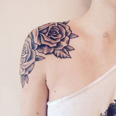 a woman with a rose tattoo on her shoulder