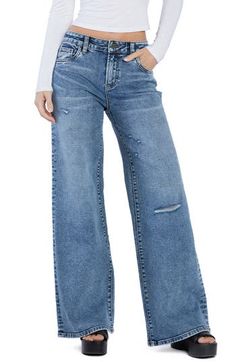 Floor-sweeping wide legs bring a stunningly chic look to these lightly distressed high-rise jeans made with a hint of shape-retaining stretch. 32" inseam; 24" leg opening; 10 1/2" front rise (size 27) Zip fly with button closure Five-pocket style 67% cotton, 29% REPREVE® recycled polyester, 3% rayon, 1% spandex REPREVE recycled polyester is made from 100% post-consumer recycled plastic bottles Machine wash, tumble dry Imported Medium Wash Wide Leg Distressed Jeans, Distressed Wide Leg Medium Wash Jeans, Distressed Wide Leg Jeans In Medium Wash, Medium Wash Distressed Wide-leg Jeans, Wide Leg Distressed Jeans In Medium Wash, Distressed Medium Wash Wide Leg Bottoms, Distressed Wide Leg Medium Wash Bottoms, Medium Wash Distressed Wide Leg Bottoms, Distressed Washed Blue Wide Leg Flare Jeans