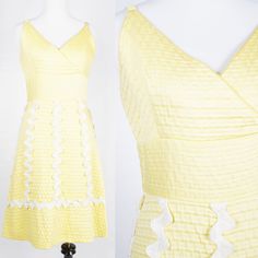 S T R A I G H T T A L K ▲ Circa: 1960s ▲ Tag: Henri Ravoux Creations ▲ Material: Cotton Poly Blend ▲ Condition: Very Good D E T A I L S ▲ Heavy waffle textured yellow cotton poly blend ▲ Spaghetti strap dress with crossover v-neckline ▲ Defined waist with white rick rack detail going down skirt of dress ▲ Knee-length a-line skirt ▲ Unlined ▲ Covered zipper in back Please note, the first few photos are slightly washed out, and the bright yellow of the dress is more in line with the last photos. C 1950s Style Spring Cocktail Dresses, 1950s Style Summer Cocktail Dress, 1950s Style Summer Dress With Ruffles, 1950s Style Ruffled Summer Dress, Mid-century Summer Party Dresses, 1950s Style Cocktail Dress For Spring, Retro Summer Cocktail Dresses, 1950s A-line Dress For Spring, 1950s Style Knee-length Spring Dresses