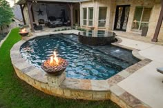 a backyard with a pool and fire pit