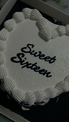 a white cake with the words sweet sixteen written on it in black and silver icing